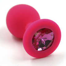 Анальная пробка из силикона с темно-розовым стразом в основании размер М, розовая